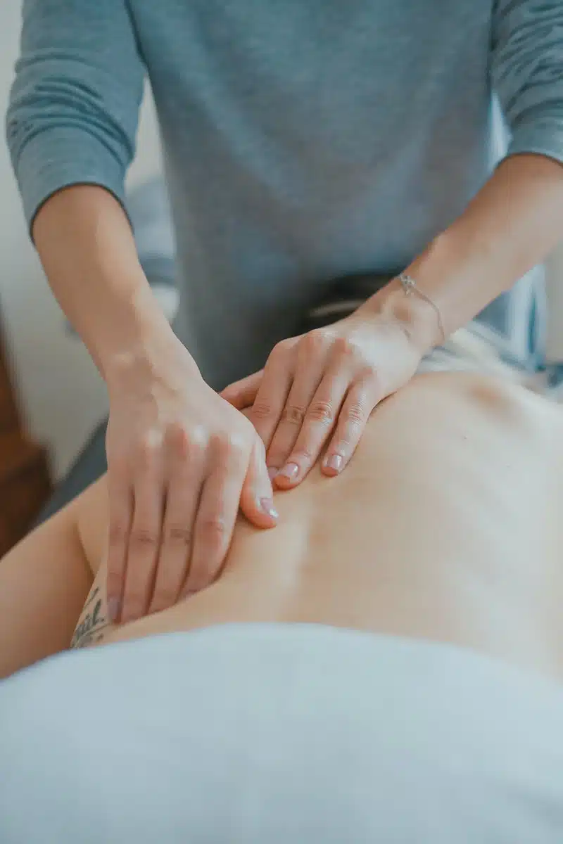 man massaging woman's body